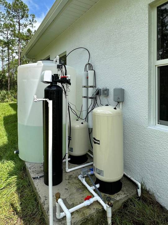Reverse osmosis system with filter tanks below a window